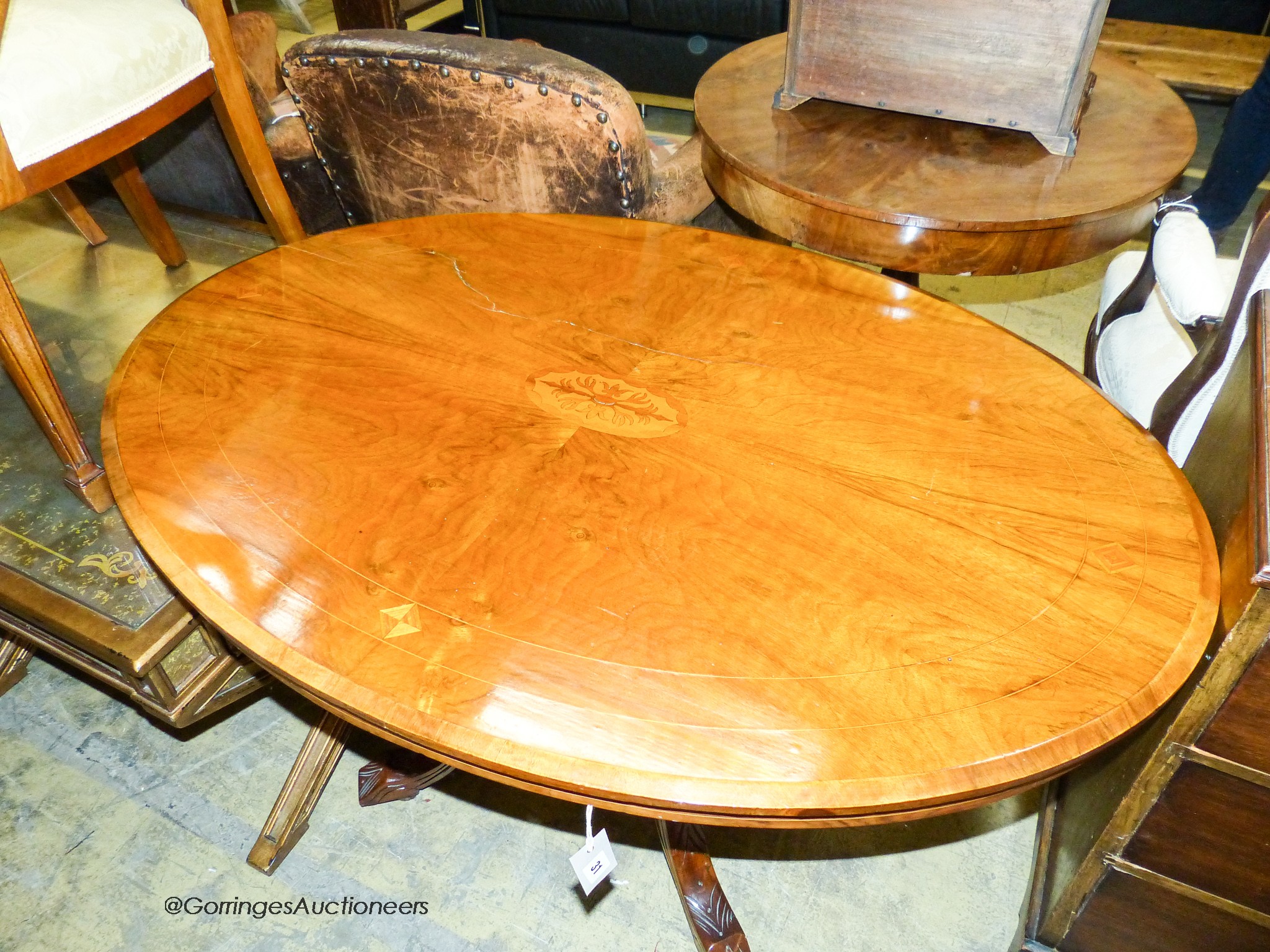 A late Victorian walnut tilt top oval breakfast table, width 116cm, depth 84cm, height 70cm